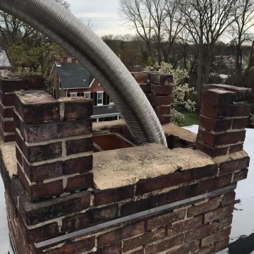The top of a chimney that is having the flue relined with stainless steel.