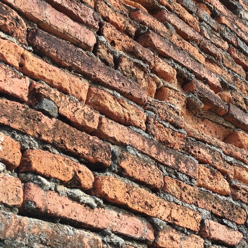 Masonry in need of repairs on a home.
