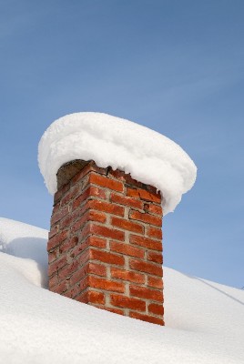 Chimney covered in snow.